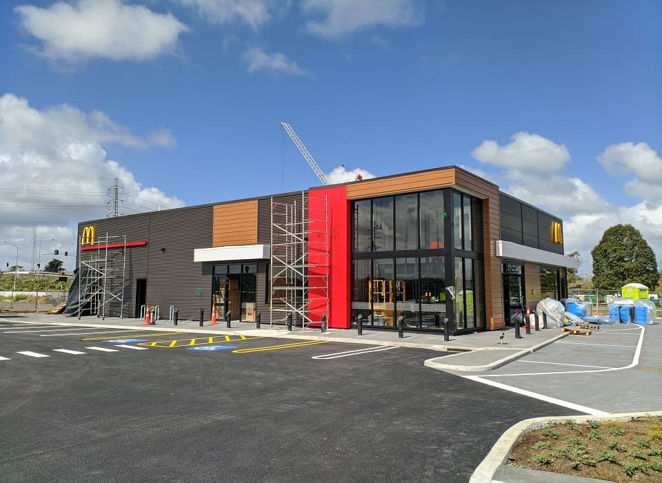 McDonald's Karaka restaurant steel frame construction with diagonal bracing and stiffened raft foundation Auckland structural engineering